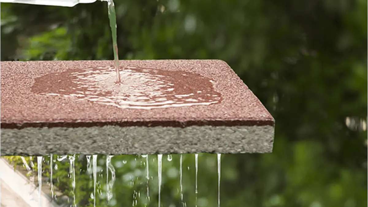 Water passing through a ceramic permeable paver.